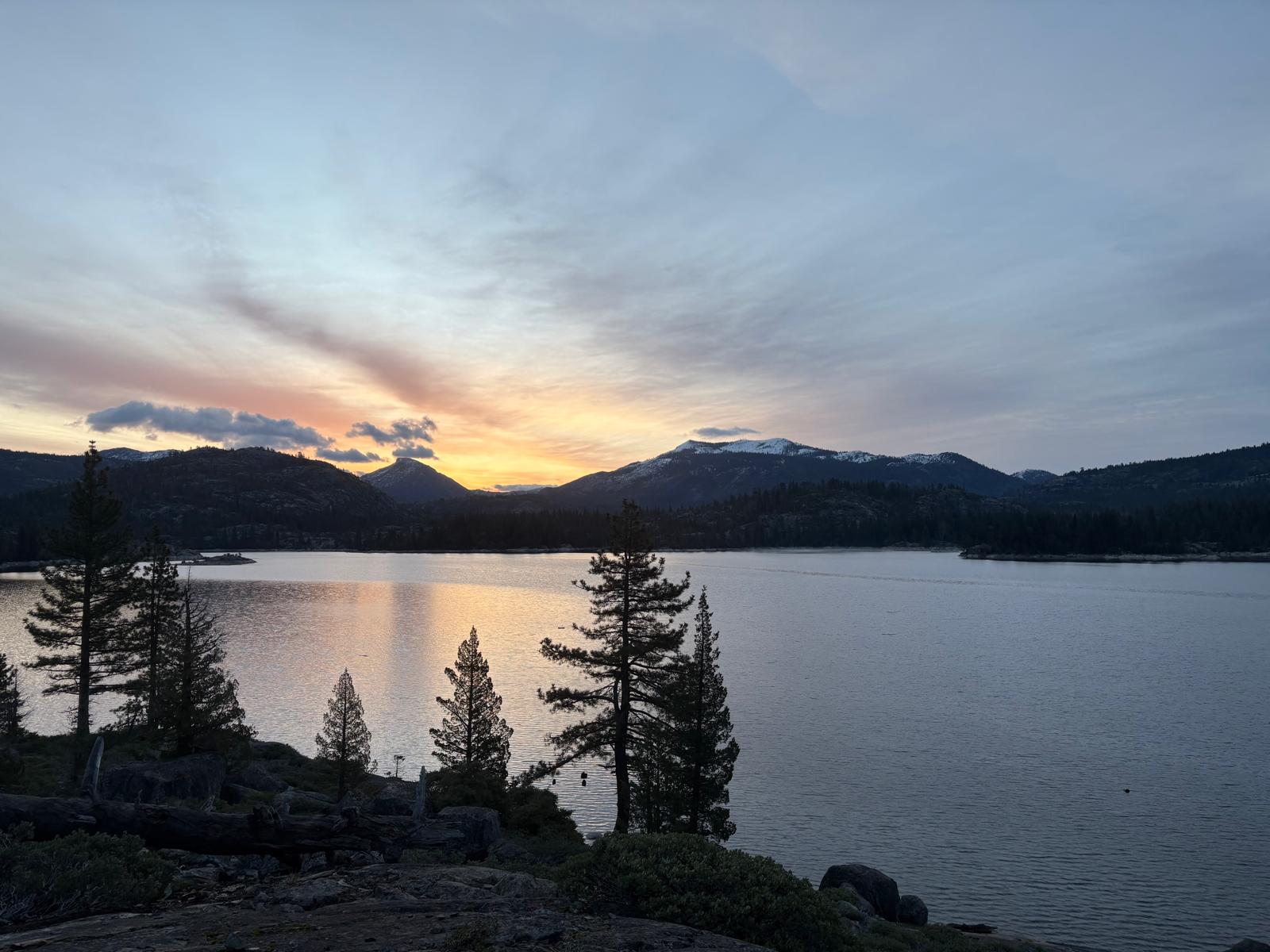 Sunset over the lake and mountains